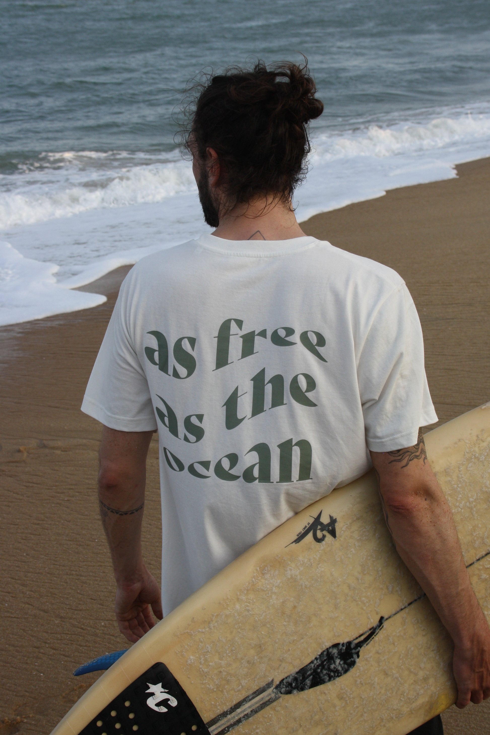 Unisex AFATO shirt with the inspirational 'As Free As The Ocean' print – perfect for a relaxed day at the beach or casual outings.