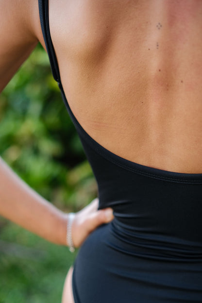 Close-up of AFATO Oceansuit in black – highlighting technical fabric and premium surfwear quality.”
