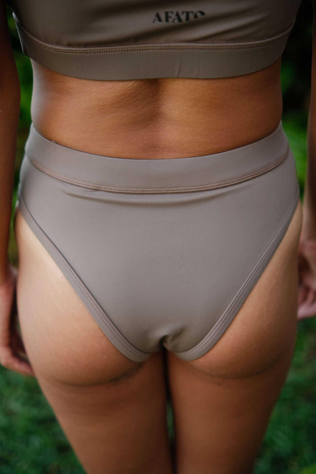 AFATO Rise Leg Bottom in mocha – back view highlighting a minimal and comfortable surfwear bikini design.”