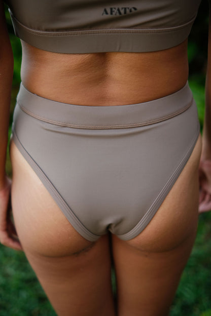 AFATO Rise Leg Bottom in mocha – back view highlighting a minimal and comfortable surfwear bikini design.”