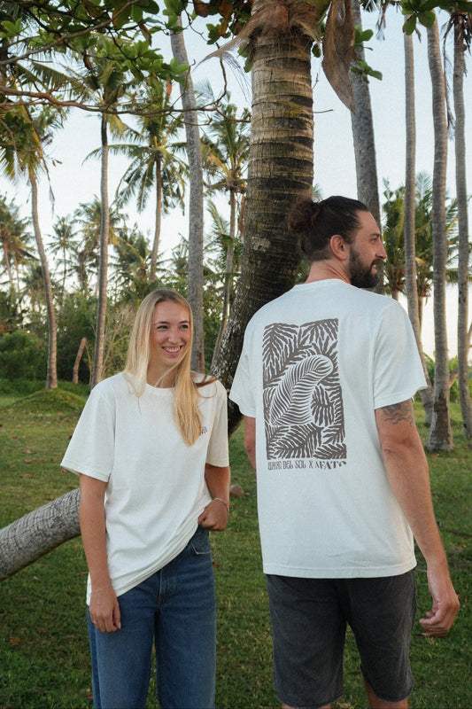 AFATO unisex Palm Rhythm shirt worn in a coastal lifestyle setting – inspired by freedom and movement.