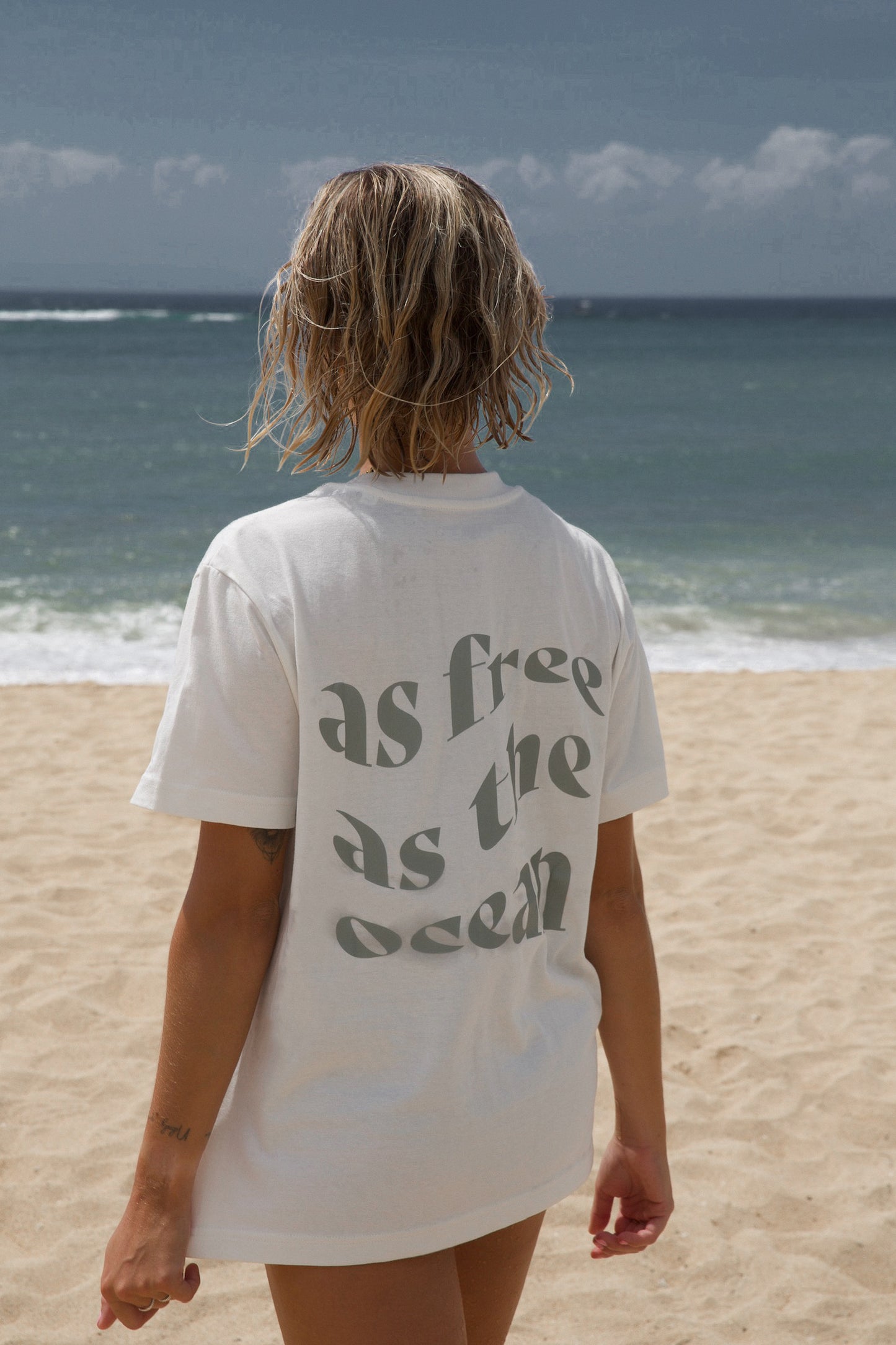 AFATO graphic unisex shirt, displaying 'As Free As The Ocean' – a statement piece for surfers and nature lovers.